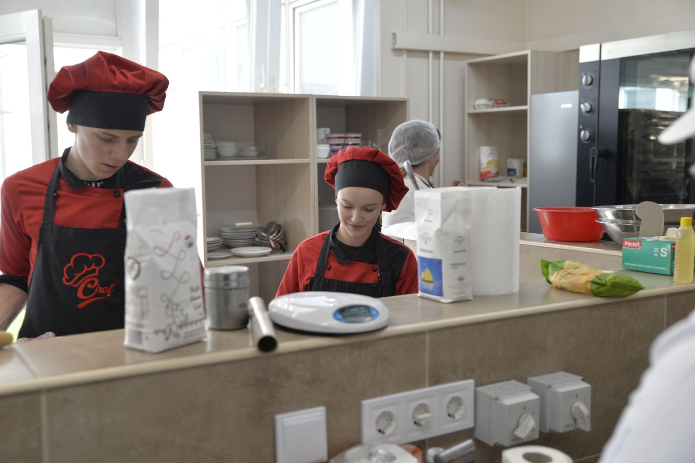 Culinary apprentices in a professional training kitchen