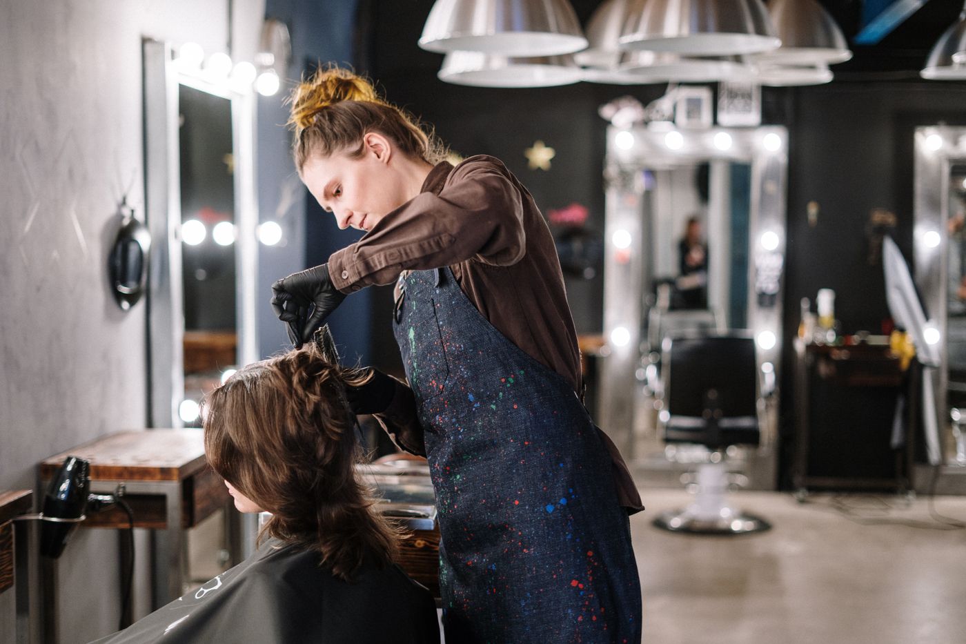 Young stylist working in a salon