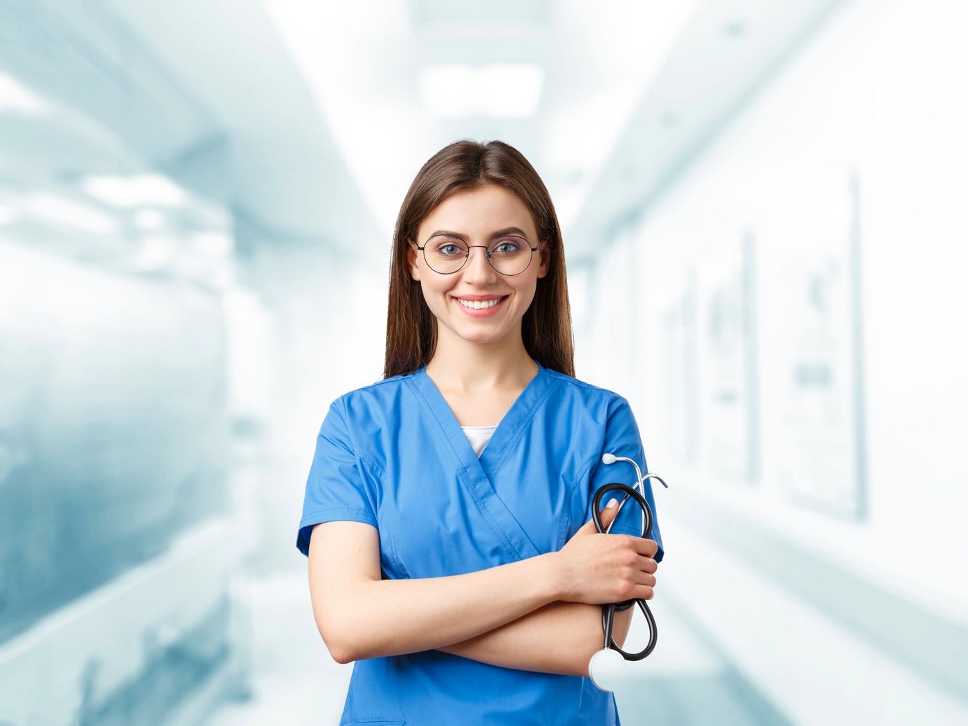 Young nurse in blue scrubs